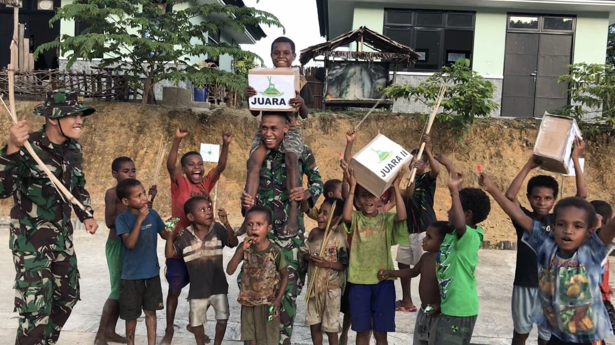 Lestarikan Budaya, Satgas Yonif 310/KK Gelar Lomba Jubi Untuk Anak-Anak Papua 1 WhatsApp Image 2024 06 30 at 13.18.29